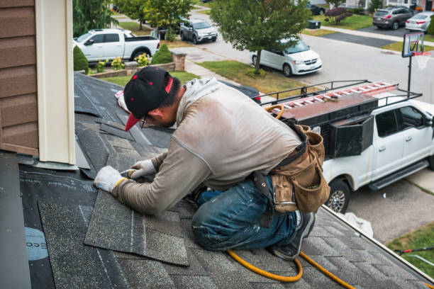 Professional Roofing technician working in Milton, VT